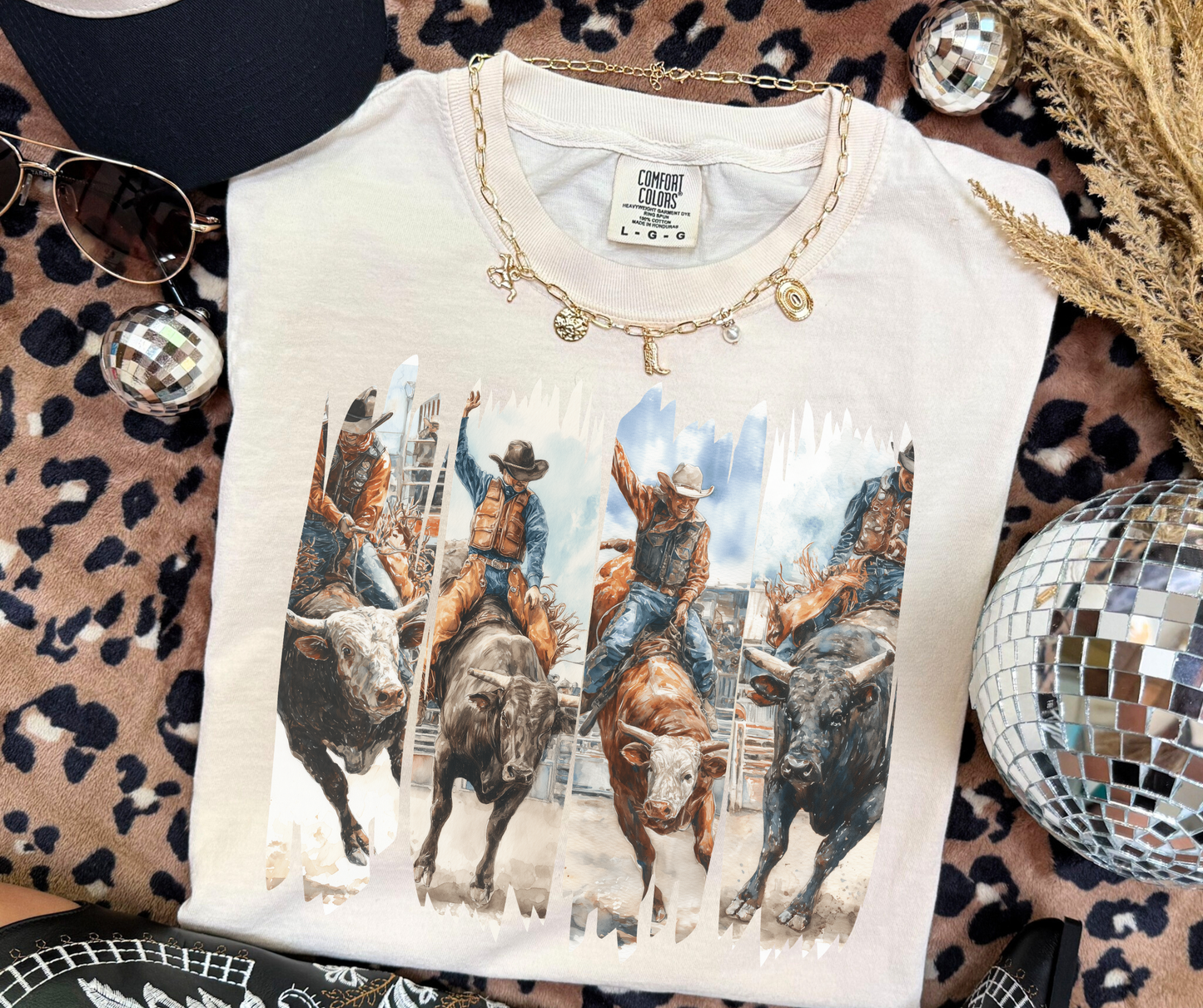 Rodeo Rush cowboy and bull riding graphic tee on Ivory Comfort Colors shirt with western rodeo artwork.