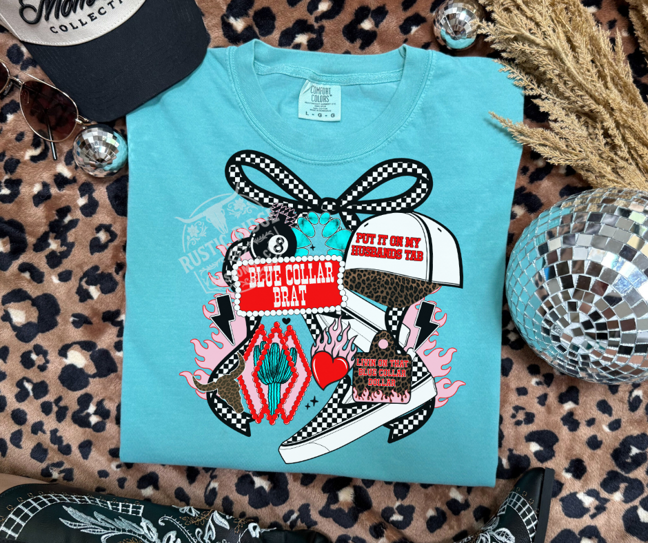 Blue collar brat graphic on comfort colors turquoise tee styled flat lay