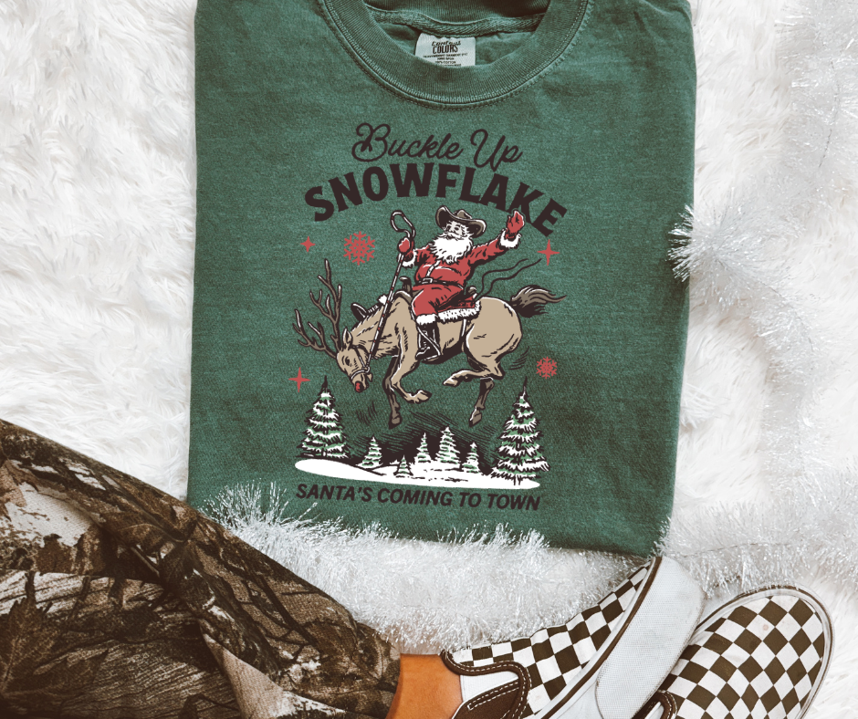 Buckle Up Snowflake western Santa graphic tee in Blue Spruce