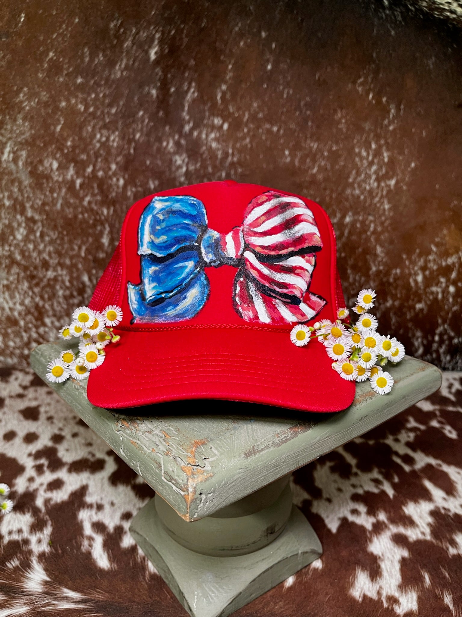 Hand-painted patriotic trucker hats featuring western Americana artwork and one-of-a-kind designs by Rustic Ridge Customs & Co