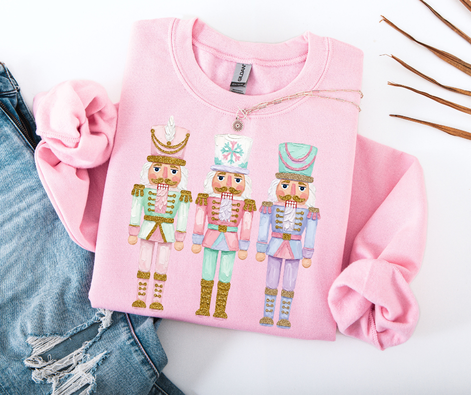 Pastel Nutcracker Christmas graphic sweatshirt in Light Pink