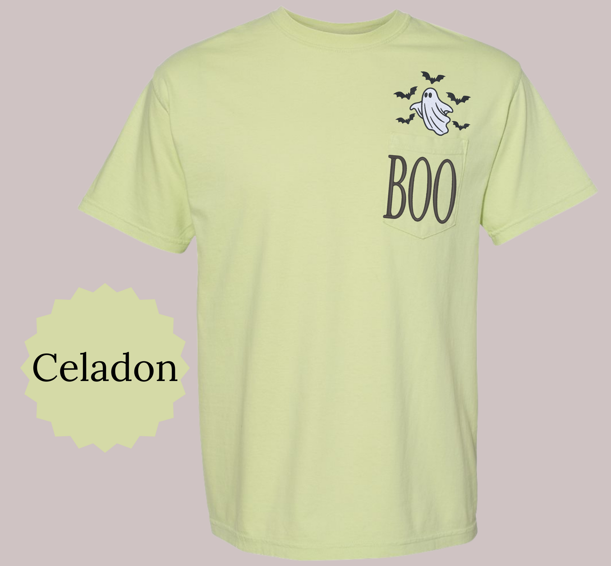 A light yellow-green pocket t-shirt with a Halloween graphic on the chest featuring a ghost, bats, and the word 'BOO'. A circular badge on the left reads 'Celadon' indicating the color name.