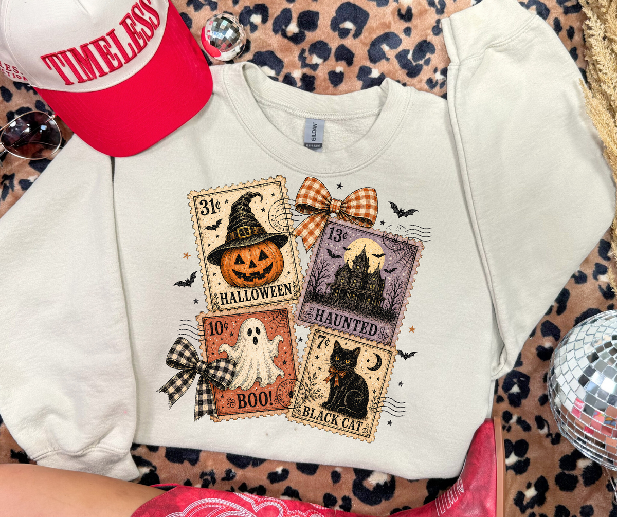 Halloween Postage Stamps graphic sweatshirt in Sand with vintage pumpkin, ghost, haunted house and black cat stamps