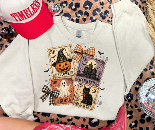 Halloween Postage Stamps graphic sweatshirt in Sand with vintage pumpkin, ghost, haunted house and black cat stamps