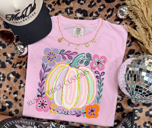 Pastel Pumpkin graphic tee in Blossom Comfort Colors with colorful floral pumpkin design