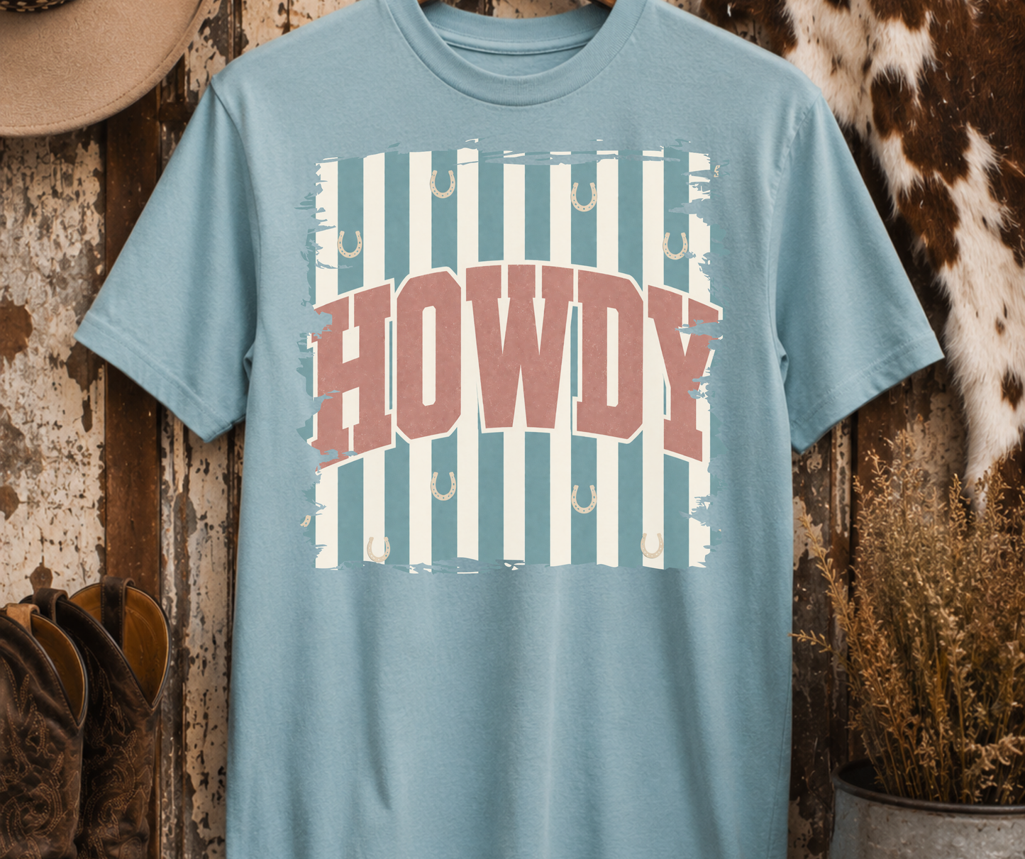 Retro Howdy Western Graphic Tee on a Yankey Blue Comfort Colors shirt with vintage western HOWDY design and horseshoes