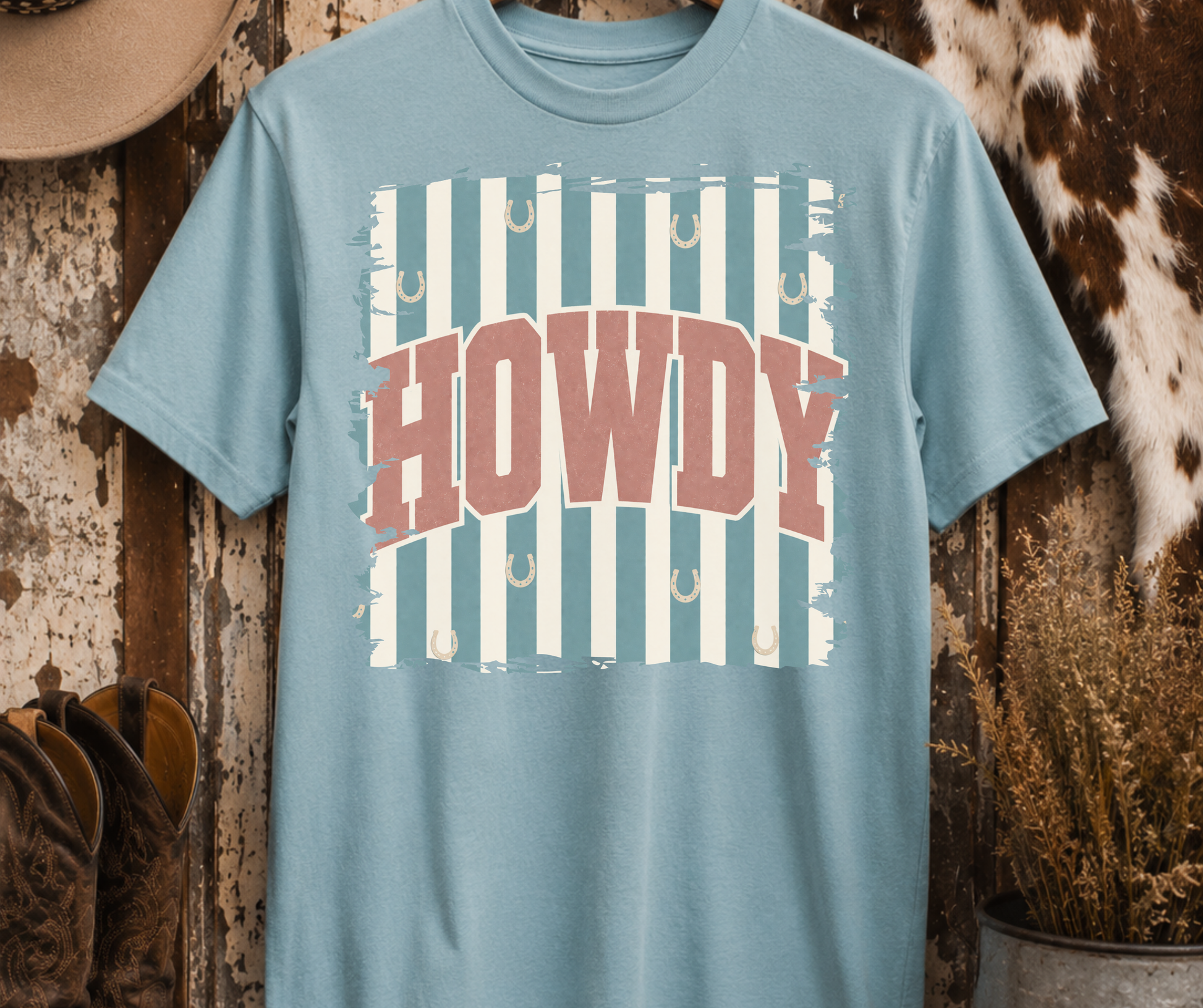 Retro Howdy Western Graphic Tee on a Yankey Blue Comfort Colors shirt with vintage western HOWDY design and horseshoes