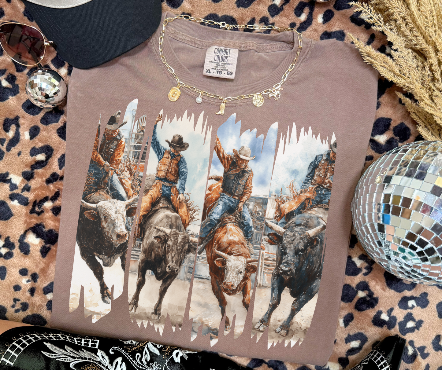 Rodeo Rush western bull riding graphic tee on Espresso Comfort Colors shirt featuring cowboys and bucking bulls.