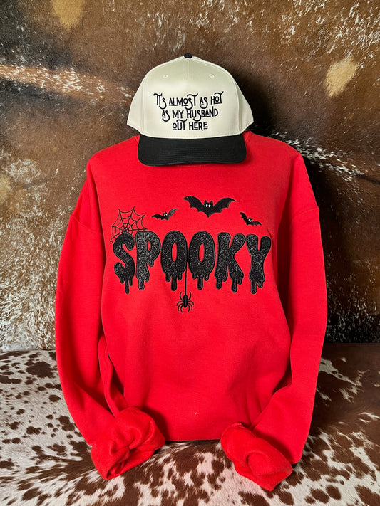 Red Halloween crewneck sweatshirt with black glitter embroidered SPOOKY lettering, bats, spiderweb and spider.