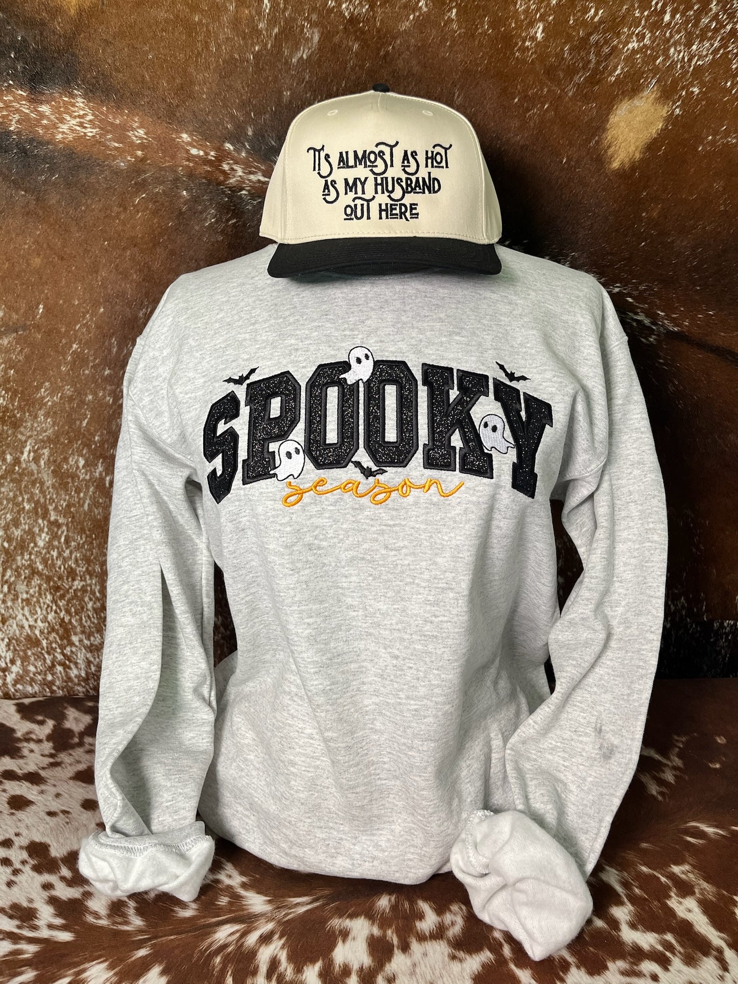 Ash gray Spooky Season embroidered Halloween sweatshirt with black glitter lettering, white ghosts, bats and orange script.