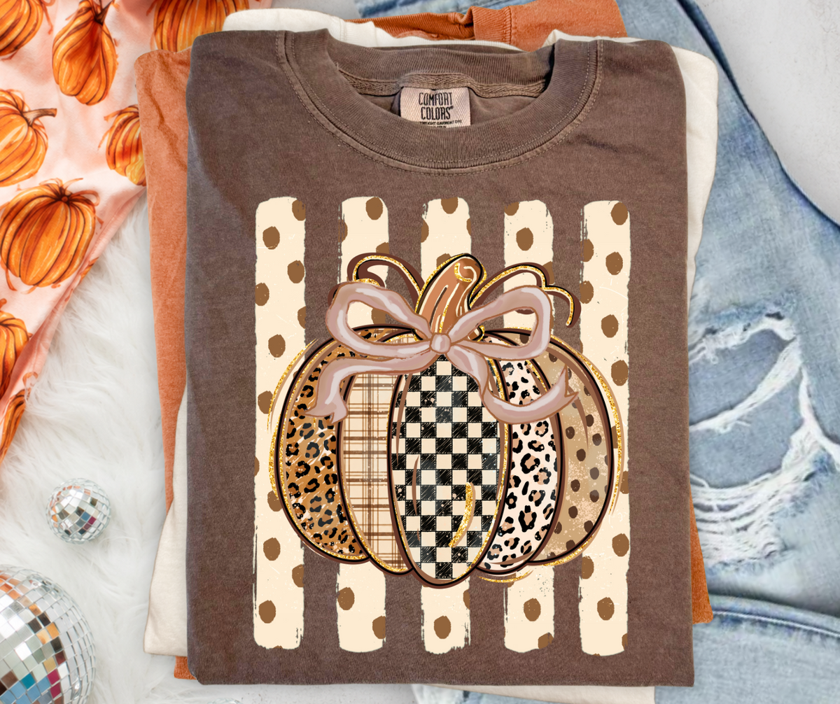 Striped Pumpkin graphic tee in Espresso Comfort Colors with neutral patterned pumpkin and bow design