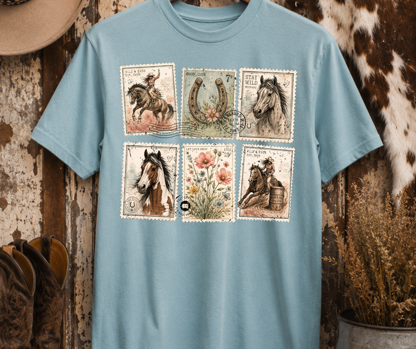 Wild and Free Western Postage graphic tee on Yankee Blue featuring vintage horse, cowgirl, horseshoe and floral postage stamps.