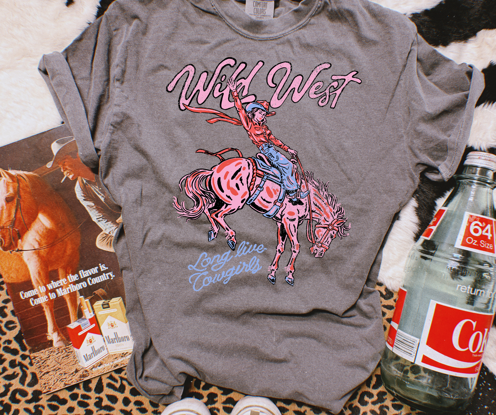 Wild West Cowgirl Graphic Tee on a Pepper Comfort Colors shirt with pink bronc rider and Long Live Cowgirls design